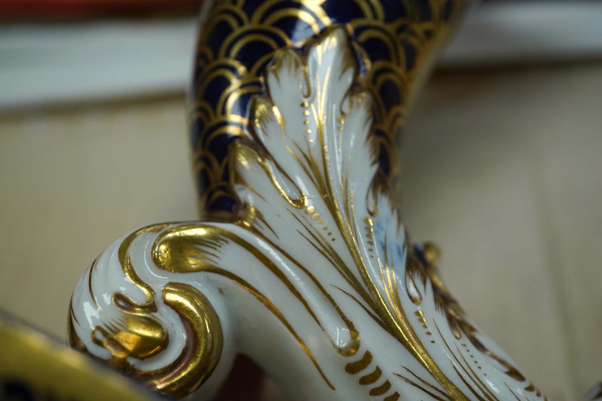 A pair of Spode-type cornucopia vases, 18cm high (a.f.). Condition - restored